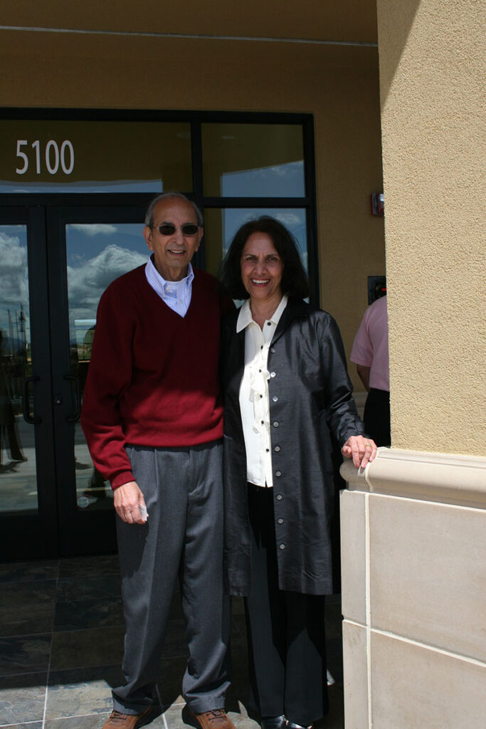 Sasha and Vern Lal in front of the Springfield Montessori School